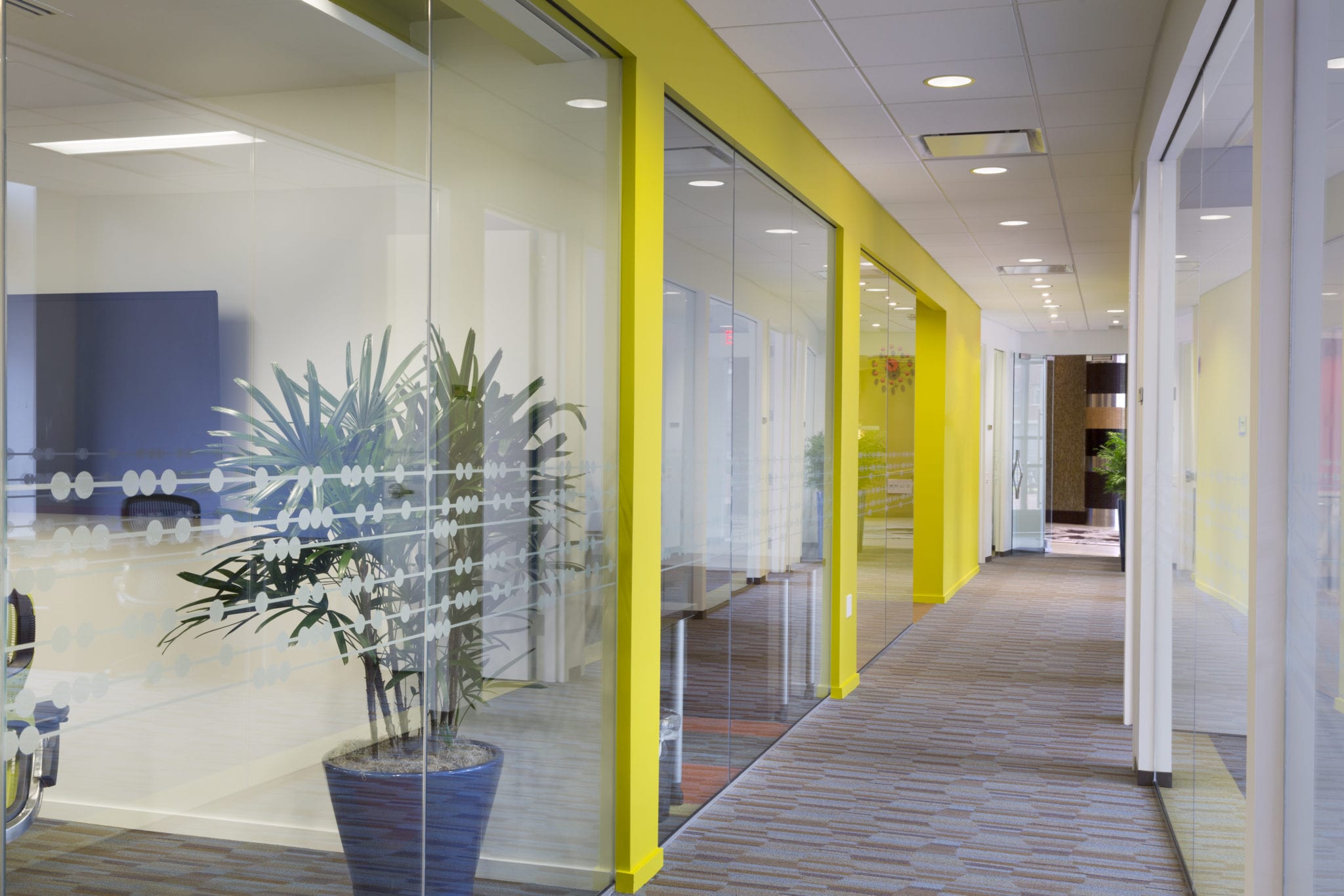 Hallway with vibrant yellow walls at the Duke Street Carr Workplaces location